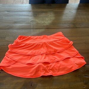 Tennis Ideology Performance Tiered Athletic Lined Women's Skort
Color Orange